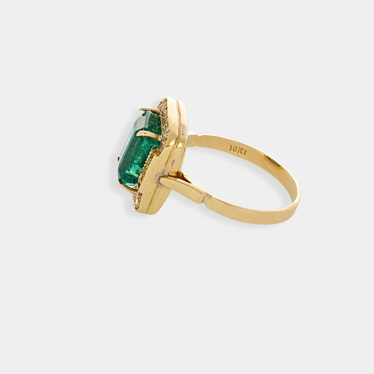 Anello Liberty in oro 18 kt con diamanti e smeraldo