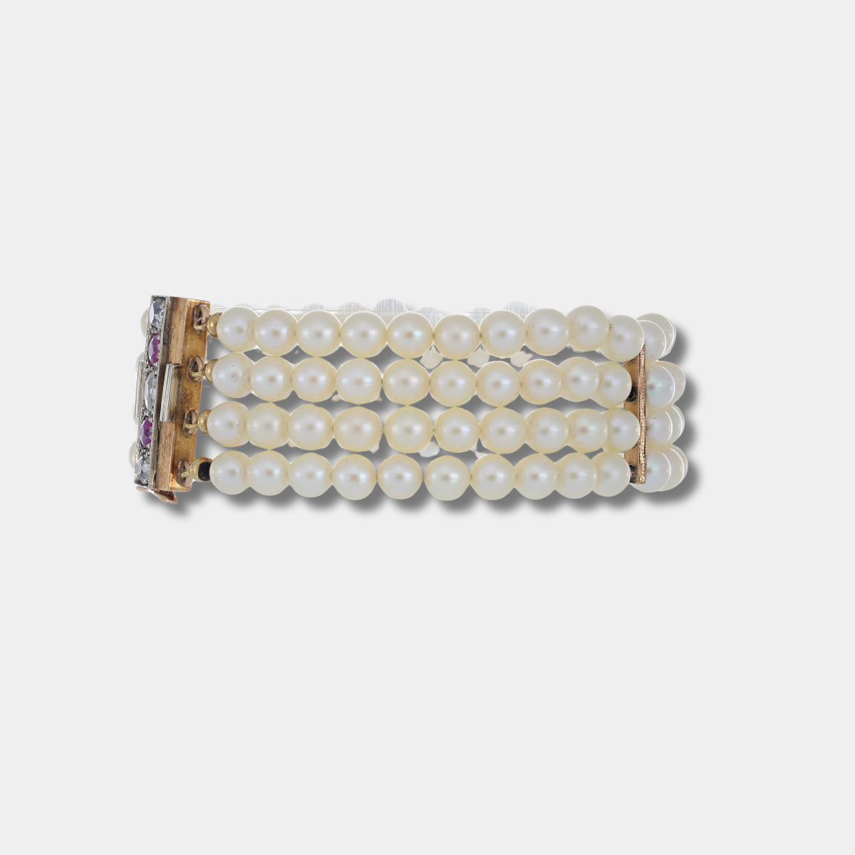 Importante bracciale con fili di perle rubini e diamanti e susta in oro massiccio
